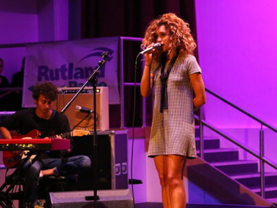 Izzy Bizu (OS 12) is a singer who has supported Coldplay and Sam Smith and performing at Glastonbury. Seen here performing at the Schools.