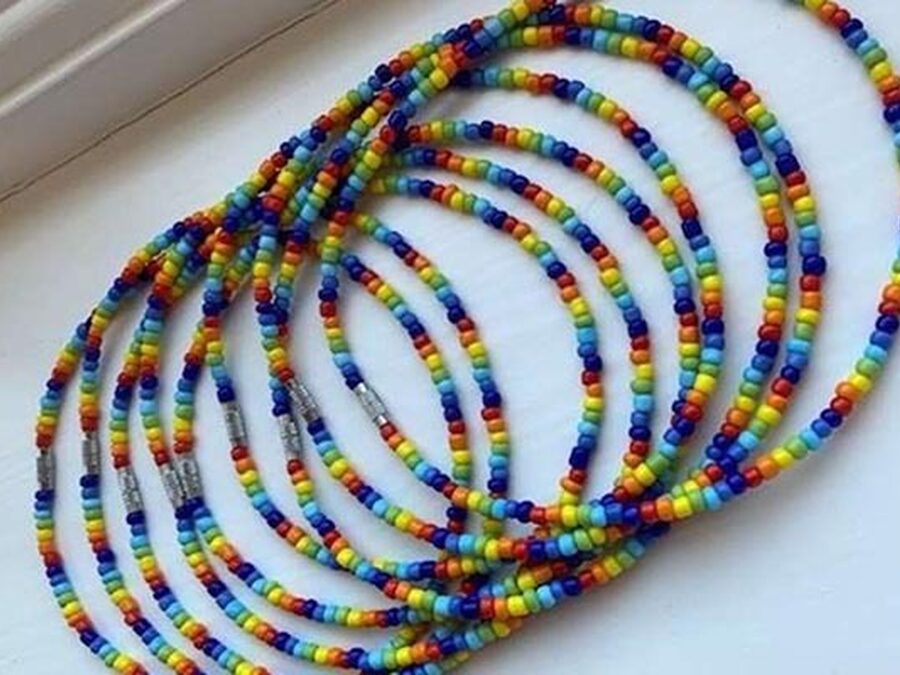 Amelia sells necklaces for NHS charities