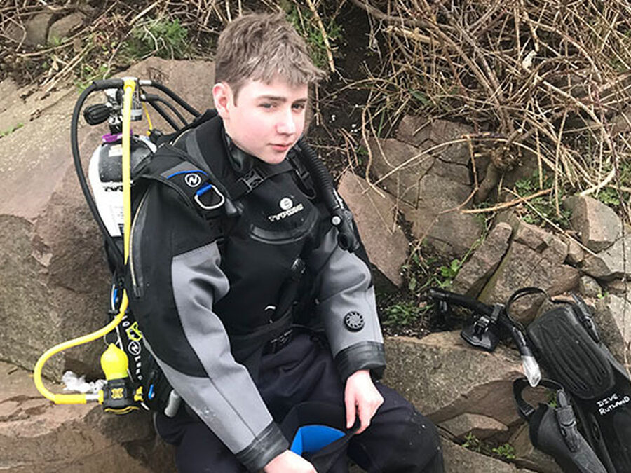 Tom earns prestigious title of Master Scuba Diver