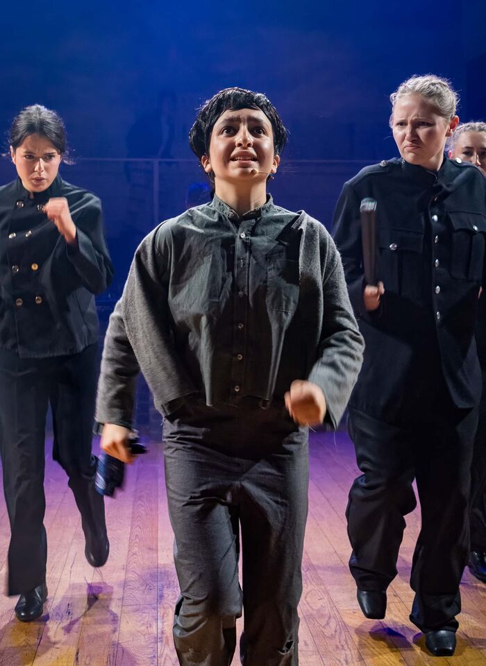 Evie (middle) as Oliver